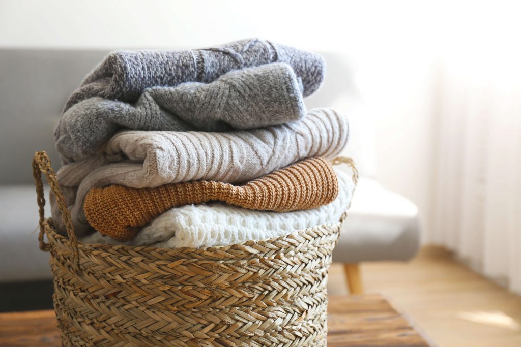 stack of washed and folded women's cashmere sweaters