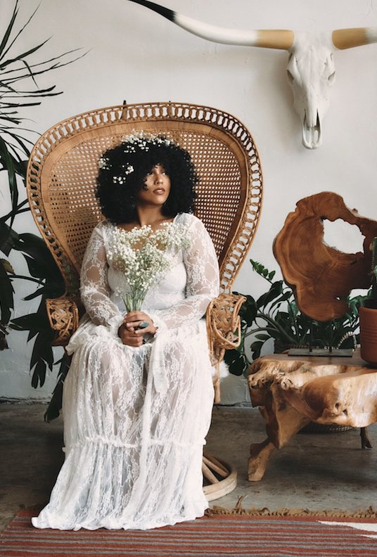 Curvy woman in a bohemian wedding dress