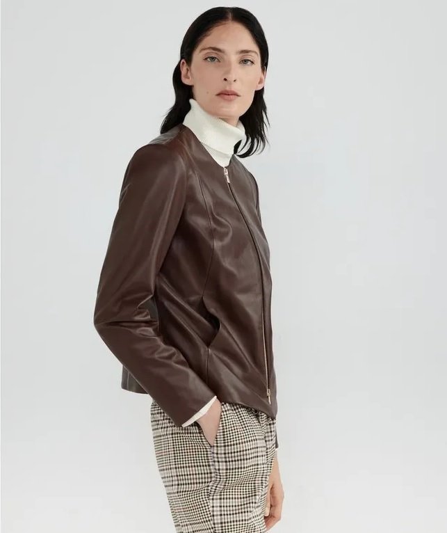 Brown faux leather jacket worn by a woman