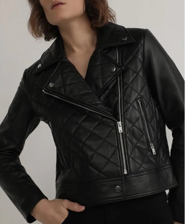 Quilted black jacket worn by a woman