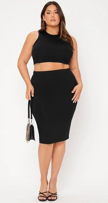 Woman wearing a black pencil skirt that slims her curves