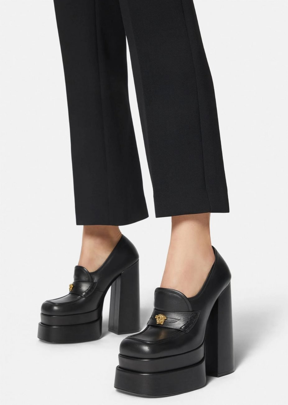 Very trendy women's platform loafers worn with a tube pant