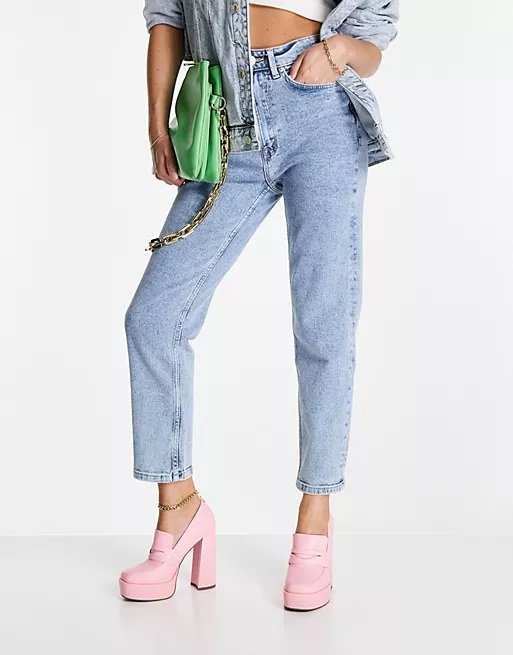 Pink heeled platform loafers worn with mom jeans