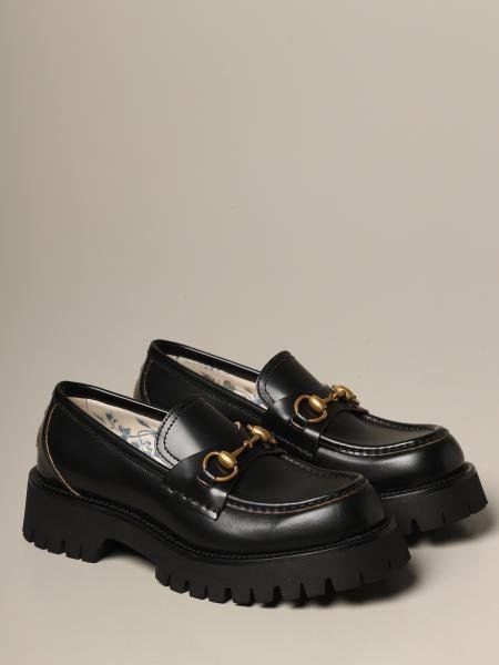 Black loafers with gold bits from Gucci