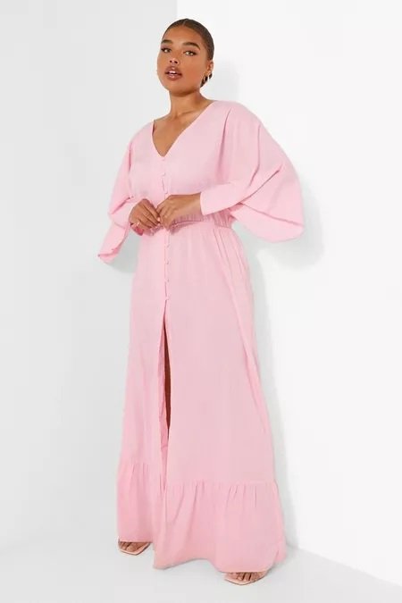 Pink empire dress worn by a curvy woman