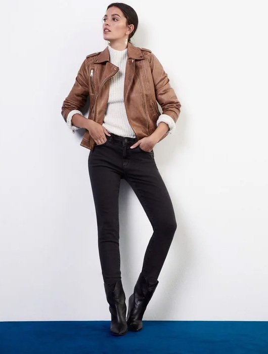 Brown biker jacket worn by a brunette woman