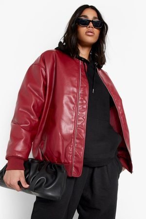 Streetwear look of a brunette woman with a red faux leather bomber jacket