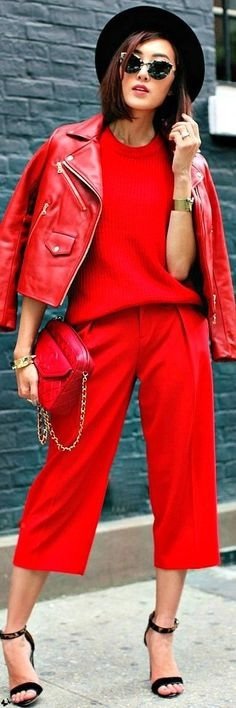 Total red look with a faux leather perfecto worn by a woman