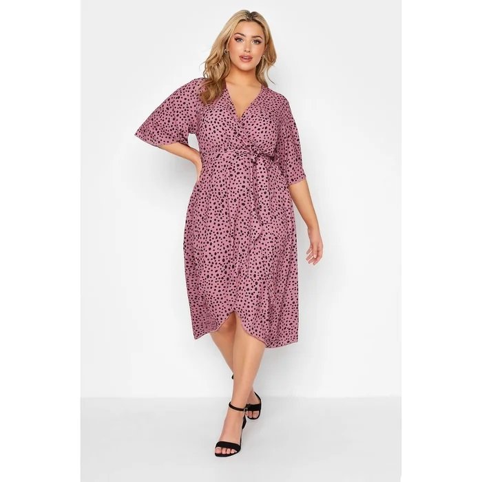 Pink dalmatian print dress worn by a curvy woman