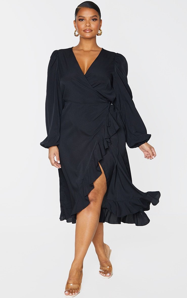 Very elegant curvy woman wearing a black wrap dress