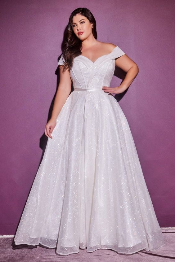 A shimmering skater wedding dress worn by a curvy woman