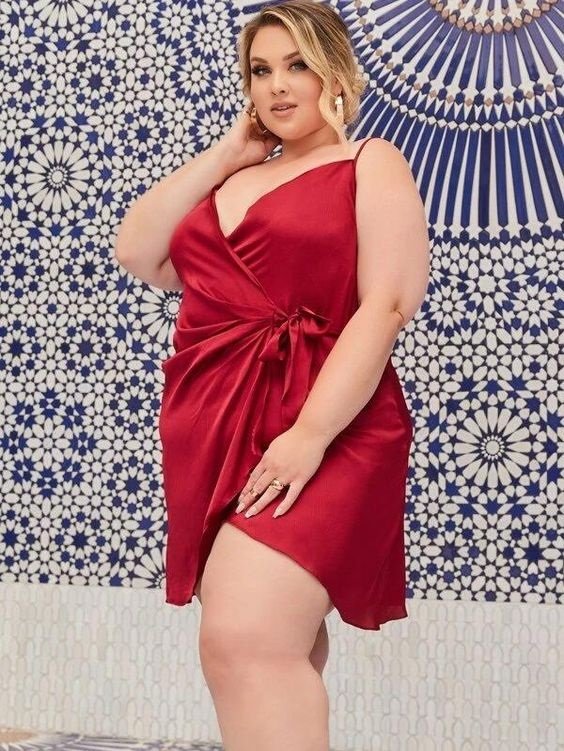 Very sexy satin dress worn by a curvy woman