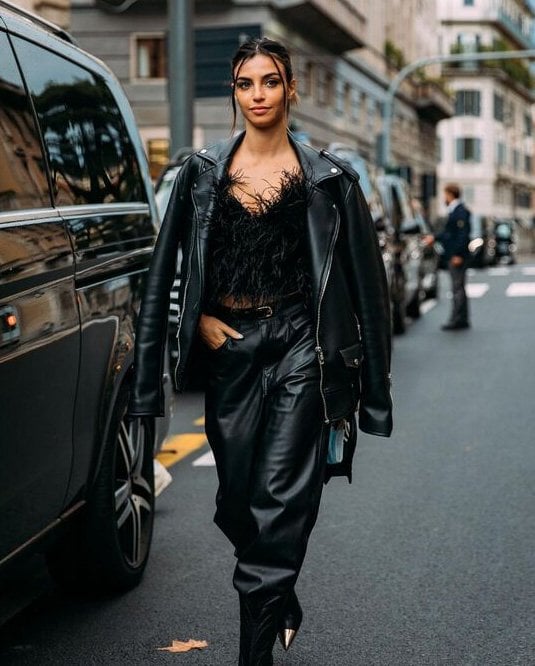 Total oversized look worn by a woman with a leather jacket