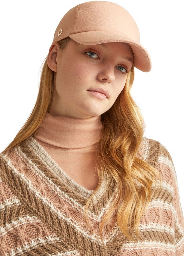 Woman wearing a pink cashmere cap