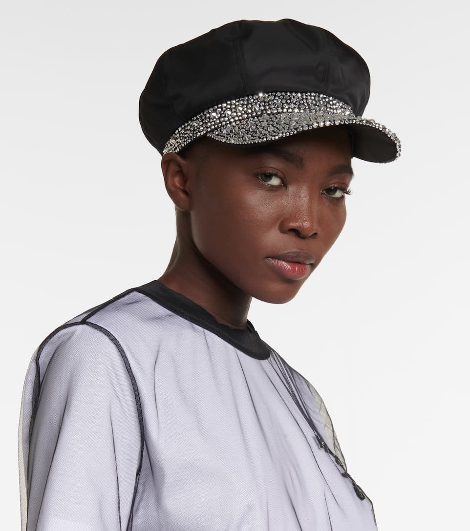 Woman wearing a newsboy cap from Prada