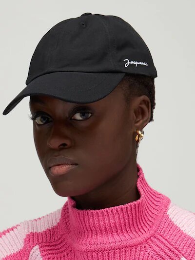 Woman wearing a black cap from Jacquemus