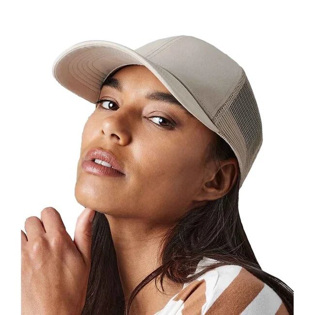 A beautiful woman wearing a beige trucker cap from Beechfield