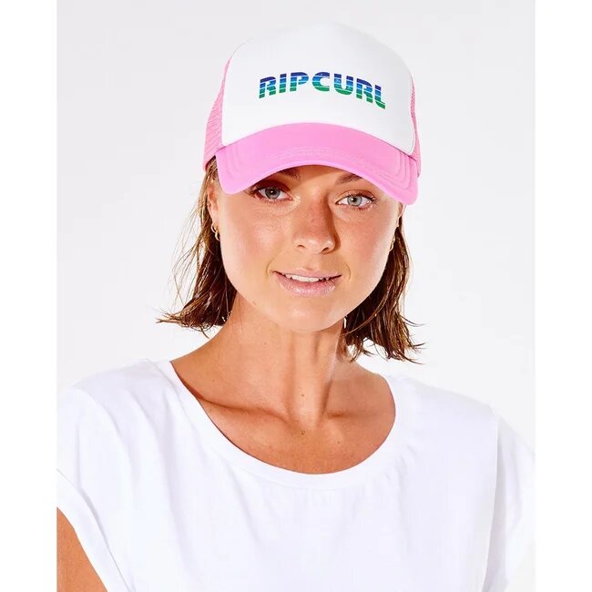 Woman wearing a pink trucker cap from Rip Curl