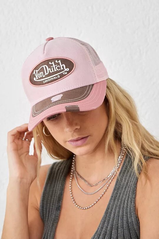 Woman wearing a corduroy trucker cap from Von Dutch