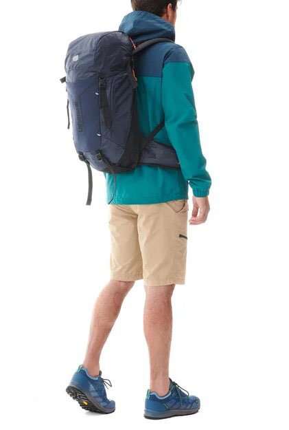 Man wearing a trekking backpack from Lafuma brand