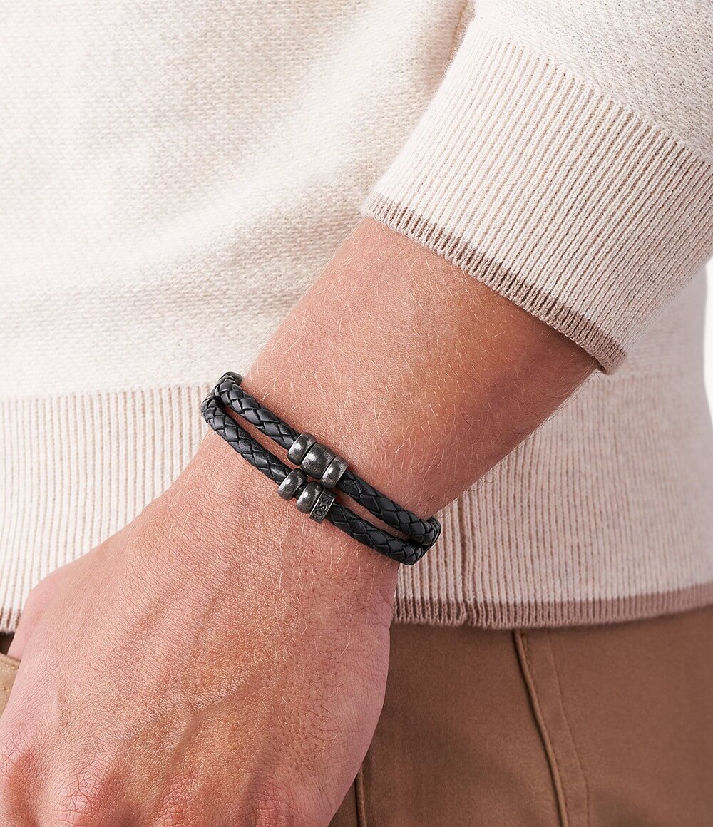 Man wearing a black leather bracelet from Fossil