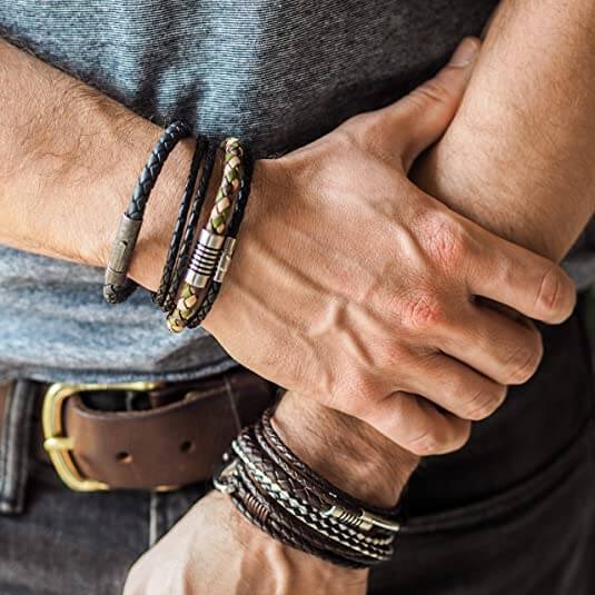 Man wearing several leather bracelets