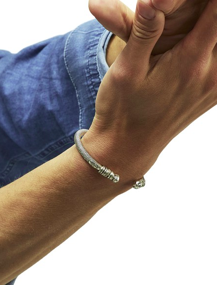 Man wearing a silver bangle bracelet from Gas Bijoux