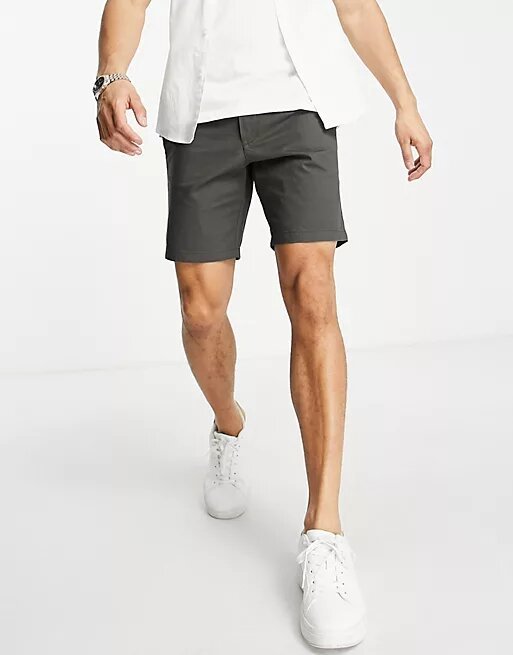 A man wearing cotton chino shorts