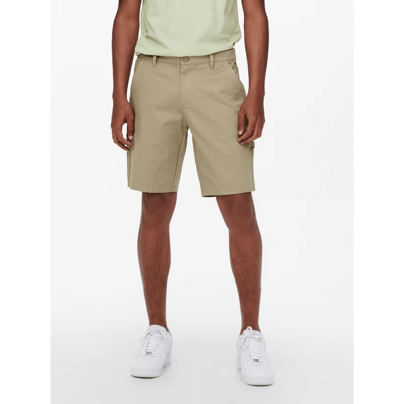 Man wearing long shorts from the brand Only & Sons.