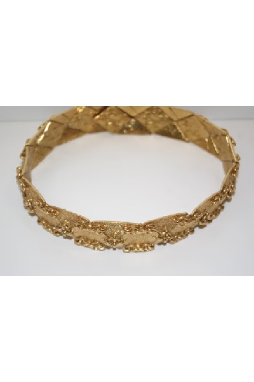 Vintage golden jewelry by Yves Saint Laurent