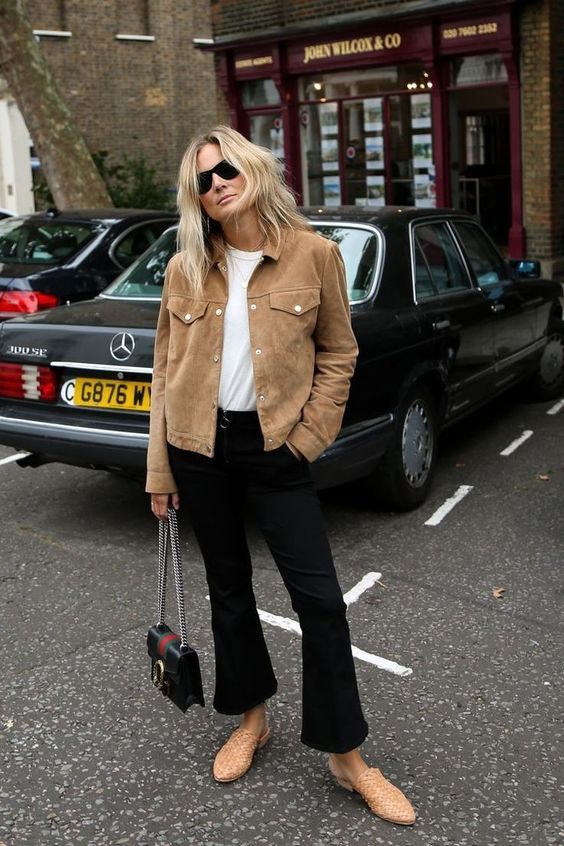 beige suede jacket worn by a woman on the street