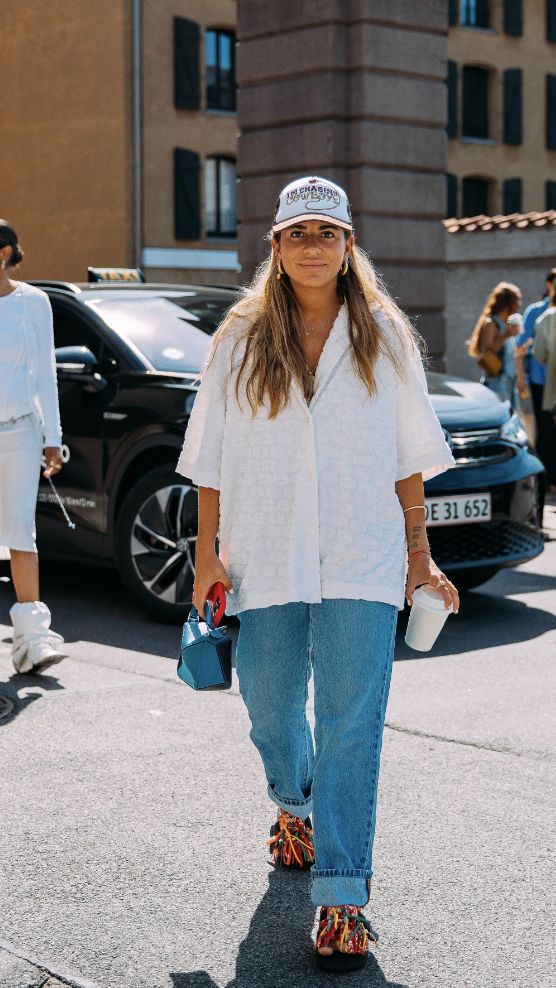 Woman being photographed in a spring outfit