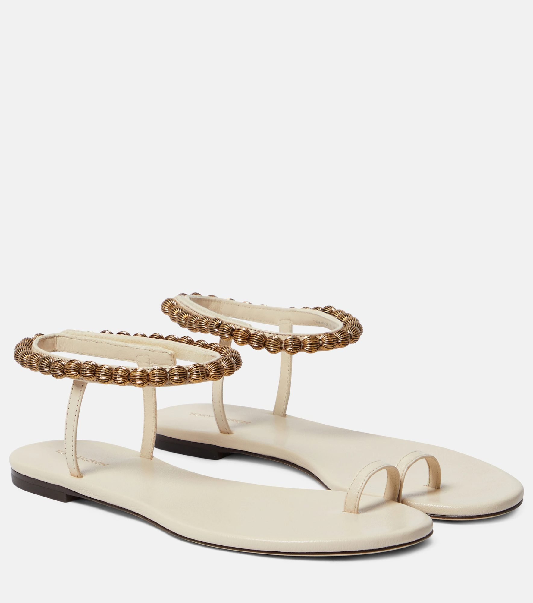 White and gold flat sandals by Tory Burch