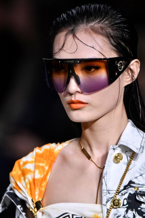 Futuristic sunglasses Versace worn at Milan Fashion Week