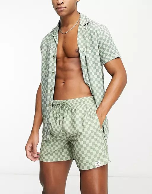 Discreet green and white checkered swim trunks by Hunky Trunks