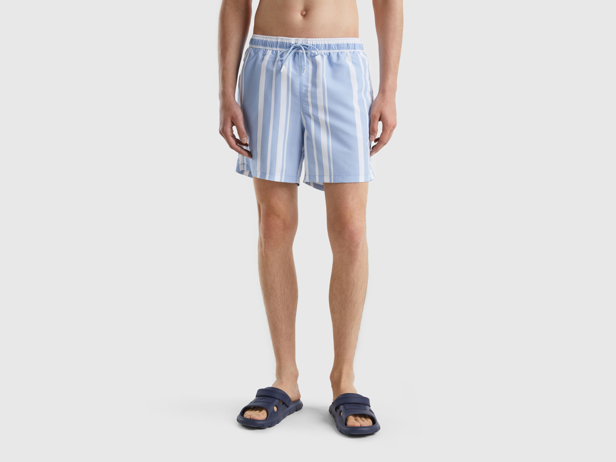 Blue and white striped swim trunks by Benetton