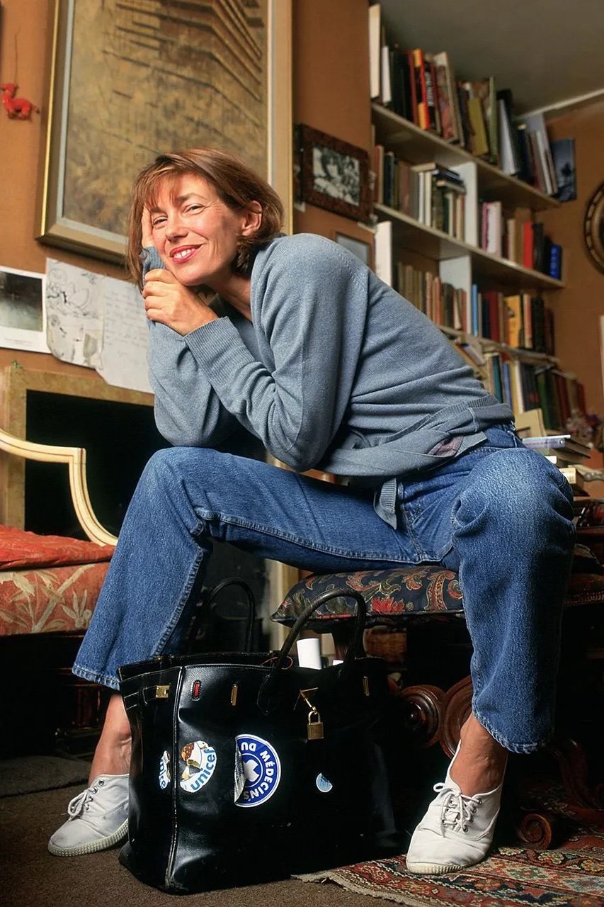 Jane Birkin posing with her Hermès Birkin bag