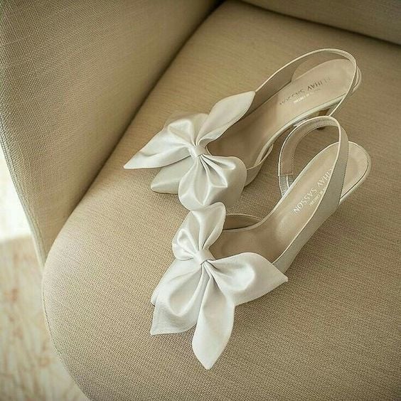 White heels with large bows