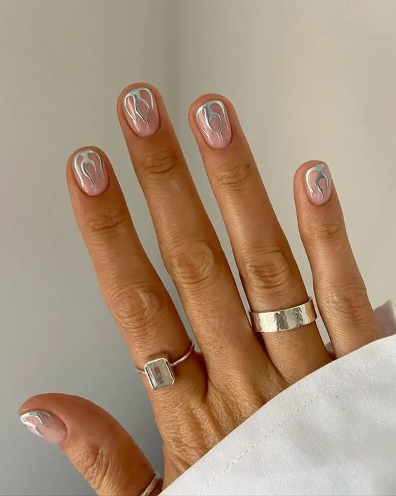 Metallic manicure with silver flames