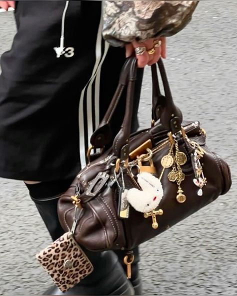 Accumulation of trinkets on handbag