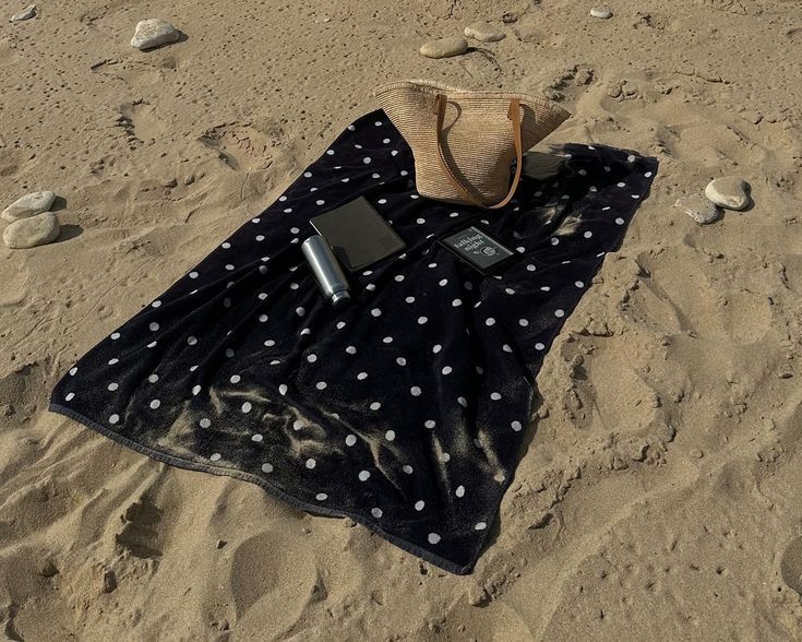 The polka dot print is back like never before! 37 Black beach towel with polka dots