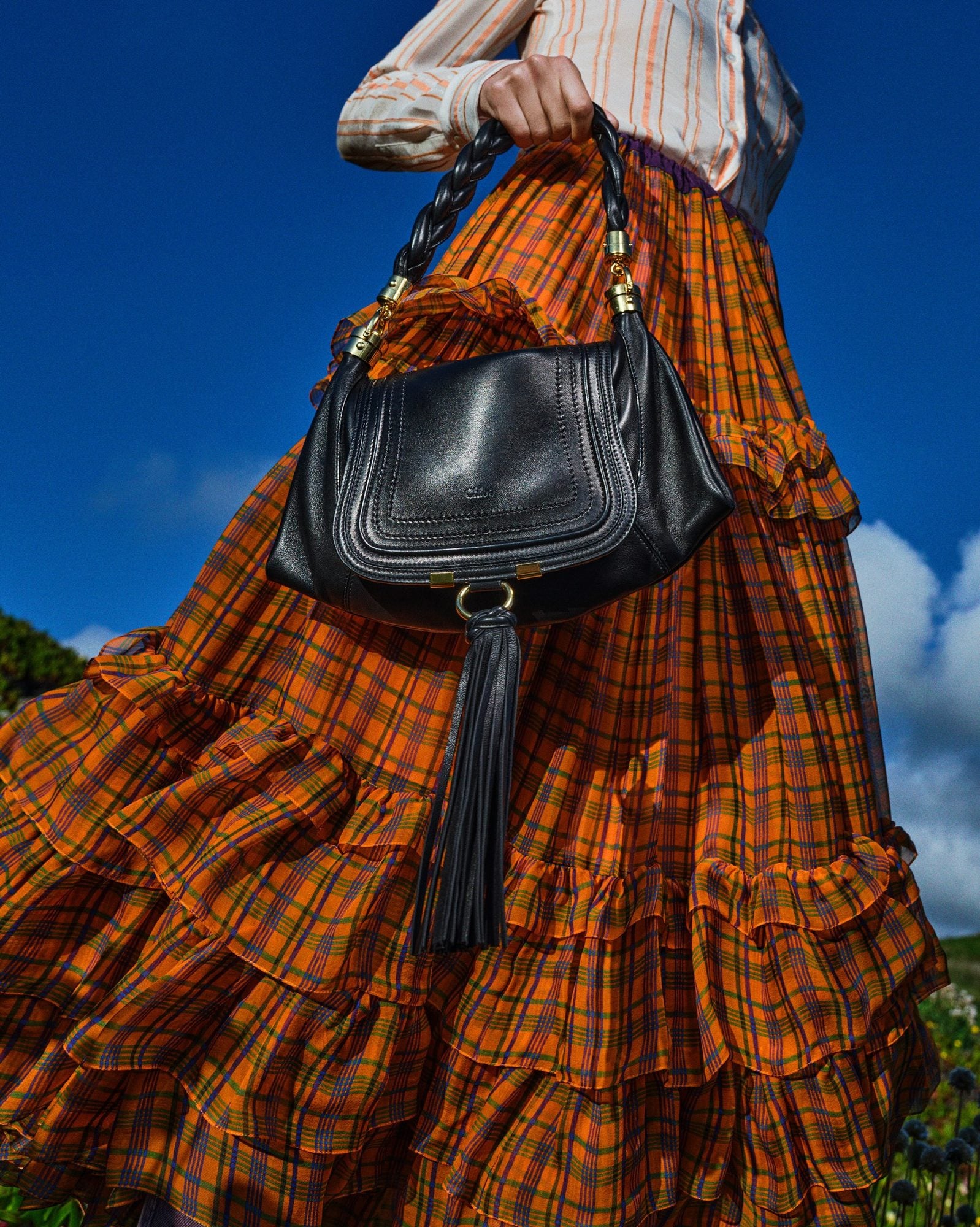 Tartan and Argyle as Signature Patterns This Autumn 3 Long tartan skirt FW26 Chloé